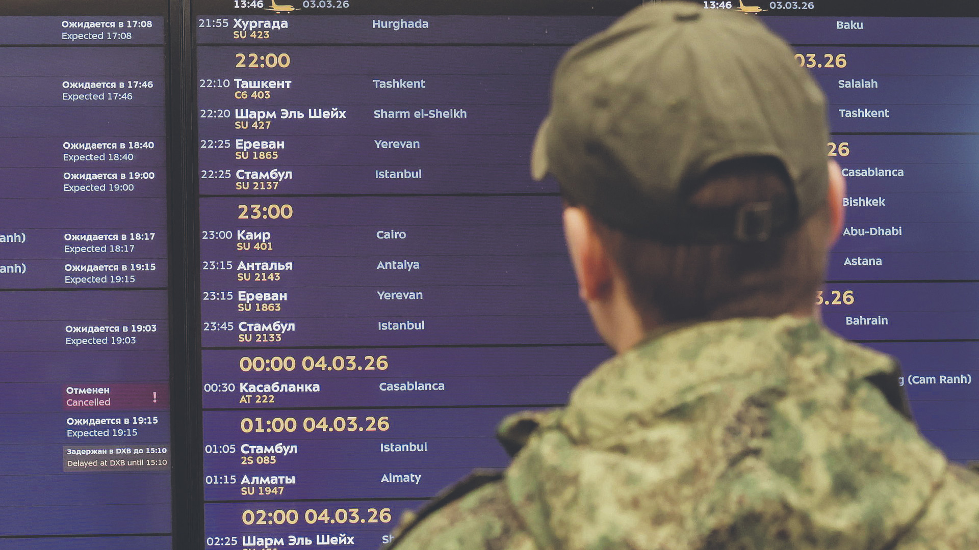 epa12791759 A passenger looks at a screen showing updates on flights at the Sheremetyevo International Airport outside Moscow, Russia, 03 March 2026. Russian Airlines Aeroflot has announced the start of outbound flights from the UAE after suspending flights to the Middle East amid the military operation by Israel and the United States against Iran. Three of the company's aircraft will fly from Dubai and Abu Dhabi to Moscow on 03 March, the Aeroflot press service said.  EPA/MAXIM SHIPENKOV